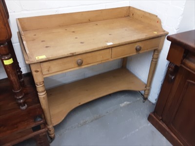 Lot 1016 - Victorian pine washstand with ledge back, two drawers and shaped undertier below