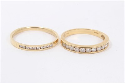 Lot 134 - Two 18ct gold diamond set half eternity rings
