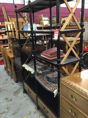 Lot 1041 - Contempory ebonised display shelf unit on turned supports with two drawers below - as new