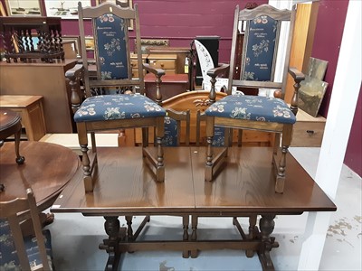 Lot 1052 - Old Charm oak dining table on turned and carved supports joined by stretcher and set of eight matching chairs comprising six standards and pair of carvers