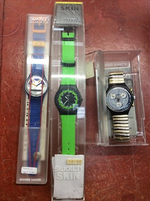 Lot 675 - Three Swatch watches, as new in cases
