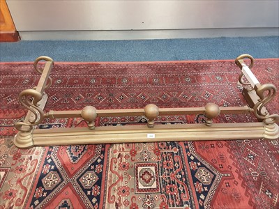 Lot 1068 - Old brass fender