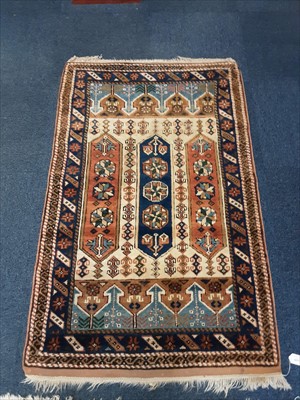 Lot 1074 - Eastern rug with geometric decoration on blue and beige ground