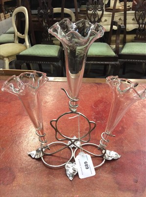 Lot 689 - Late Victorian silver plated épergne with three glass flutes