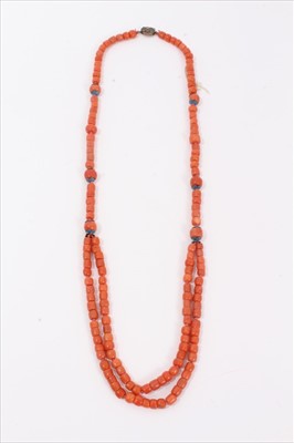 Lot 3 - Old Chinese coral necklace, six of the barrel beads flanked by blue enamel flowers terminating with a double row of coral beads and an oval silver clasp