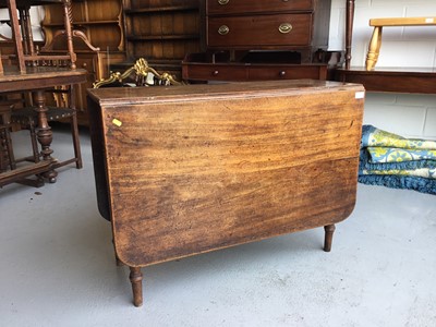 Lot 61 - Regency mahogany drop-leaf dining table