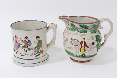 Lot 87 - 19th century Sunderland purple lustre jug, decorated in relief with an equestrian scene, and a pottery frog mug decorated with tavern scenes