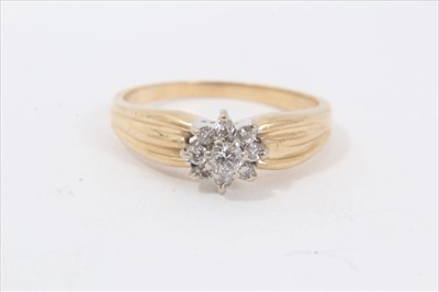 Lot 201 - 14ct gold diamond flower head cluster ring