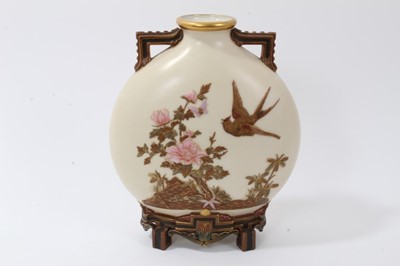 Lot 168 - Victorian Royal Worcester porcelain Aesthetic movement ‘Japanese’ moonflask vase after Christopher Dresser, with raised gilt and polychrome bird, insect and floral decoration, raised on architectur...