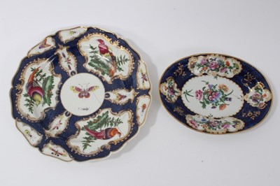 Lot 78 - Worcester plate, circa 1770, decorated with exotic birds and insects on a blue scale and gilt ground, and a similar Worcester oval dish