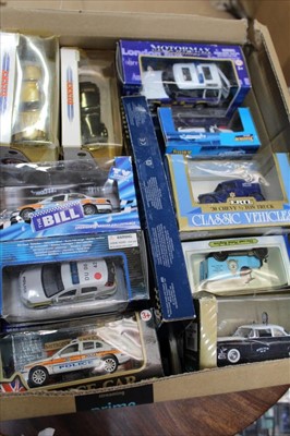 Lot 1408 - Diecast selection of police vehicles in four boxes, manufacturers including Corgi, Dinky, Lledo, Vanguards etc (qty)