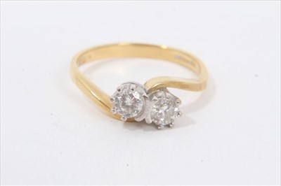 Lot 188 - 18ct gold diamond two stone cross over ring