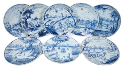 Lot 53 - Set of eight 19th century Dutch delft calendar plates, hand painted with various scenes, mark to bases, 23.5cm diameter