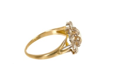 Lot 428 - Diamond flower head cluster ring with a central cushion-shape old cut diamond estimated approximately 1.51 carats surrounded by ten round brilliant cut diamonds in mille grain setting on 18ct gold...