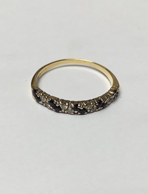 Lot 156 - Sapphire and diamond half eternity ring in 18ct gold setting