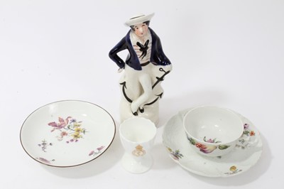Lot 141 - Two mid 18th century Meissen saucers, a teacup, a Coalport Naval eggcup and a Staffordshire figure
