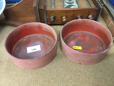 Lot 156 - Pair of Regency red papier-mâché wine coasters