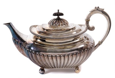 Lot 216 - Edwardian silver teapot of half fluted form with engraved heraldic crests