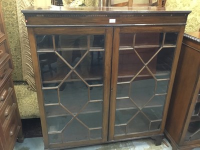 Lot 140 - Edwardian mahogany bookcase with two astragal glazed doors on bracket feet