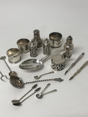 Lot 189 - A mixed group of silver and white metal to include: pair of late Victorian silver pepperettes with blue glass liners (London 1897), Victorian silver mustard pot with blue glass liner (London 1900),...