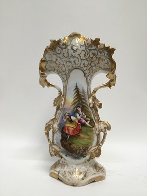 Lot 285 - Late 19th century Continental porcelain vase of shaped form with central hand painted scene depicting two figures beside the river, with gilded foliate borders, 39cm high