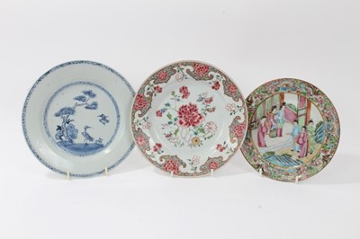 Lot 21 - 18th century Chinese famille rose porcelain plate, an 18th century Chinese blue and white plate, and a 19th century Canton plate (3)