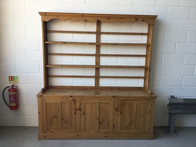Lot 1 - Antique pine two height dresser, with open shelves above with three panelled doors below, 215cm long, 227cm in overall length, 52cm deep