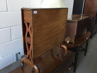 Lot 12 - Victorian walnut Sutherland table with pierced decoration, on brass castors, 69cm length, 74cm height, 16cm width (flaps down)