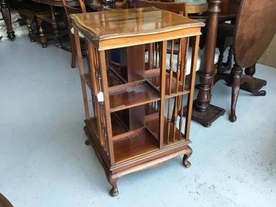 Lot 81 - Edwardian Mahogany revolving book case with cross banded decoration on cabriole legs, 51cm in diameter, 84cm in height
