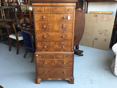 Lot 83 - Reproduction Yew wood miniature chest on chest with an assortment of 12 draws, on bracket feet, 59cm width, 125cm height, 34cm in depth