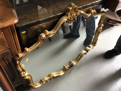 Lot 94 - Antique style gilt framed wall mirror with shell and scroll decoration together with another mirror in plain rectangular frame, gilt mirror 106cm x 80cm, other mirror 73cm x 134cm (2)