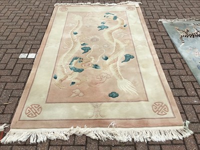 Lot 102 - Chinese wash rug with Dragon decoration, 256 x 154cm together with another decorated with Tigers, 156 x 93cm (2)