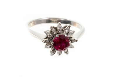 Lot 437 - Ruby and diamond flower head cluster ring