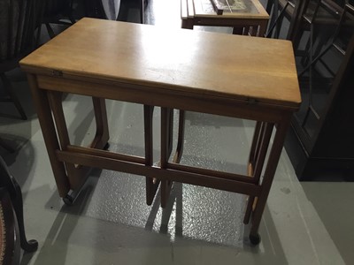 Lot 139 - McIntosh teak metamorphic nest of three occasional tables together with a nest of three tile topped occasional tables (2)