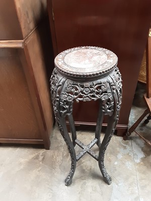 Lot 934 - Chinese carved hardwood urn stand with marble inset top