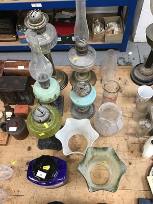 Lot 35 - Group of five oil lamps together with shades and chimneys (qty)