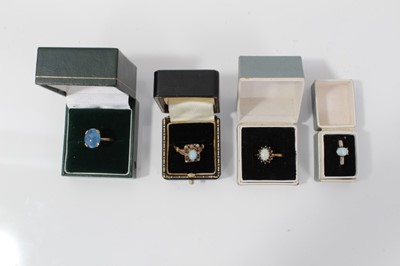 Lot 67 - Four 9ct gold opal dress rings