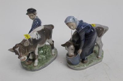 Lot 876 - Two Royal Copenhagen figures - Girl and Boy feeding calves