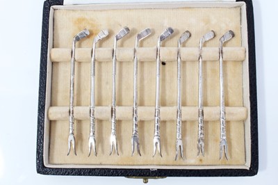 Lot 7 - Set of eight silver golf club lobster picks, in fitted case