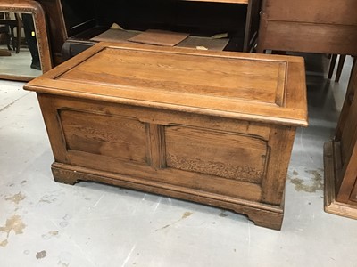 Lot 950 - Oak coffer with panelled top and sides on bracket feet.