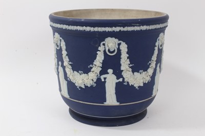 Lot 46 - Large antique Wedgwood dark blue jasper ware jardinière, circa 1890, decorated with classical figures and swags, marks to base, 23cm height x 26cm diameter