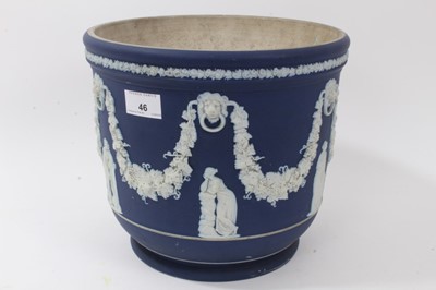 Lot 46 - Large antique Wedgwood dark blue jasper ware jardinière, circa 1890, decorated with classical figures and swags, marks to base, 23cm height x 26cm diameter