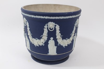 Lot 46 - Large antique Wedgwood dark blue jasper ware jardinière, circa 1890, decorated with classical figures and swags, marks to base, 23cm height x 26cm diameter