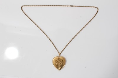 Lot 19 - 9ct gold large heart shaped locket on a yellow metal chain
