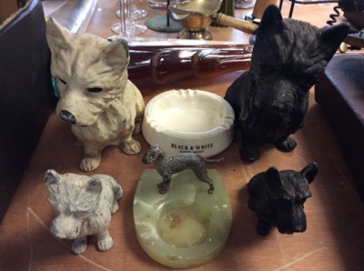 Lot 439 - Four black and white painted metal Scotty dogs, black & white scotch whisky ceramic ash tray and one other green onyx ashtray with metal dog mount