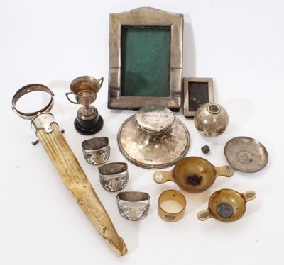 Lot 250 - Selection of miscellaneous early 20th century silver of varying condition, including an antler and silver table lighter, capstan inkwell, three napkin rings, two photograph frames and other items (...