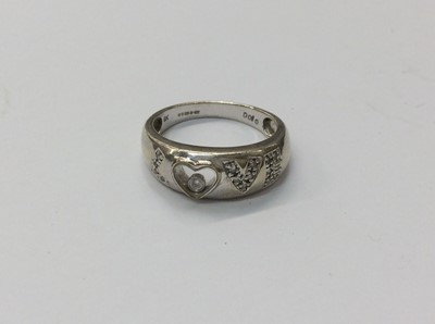 Lot 654 - 9ct white gold diamond set ‘Love’ ring with glazed heart compartment containing a single loose diamond. Ring size Q