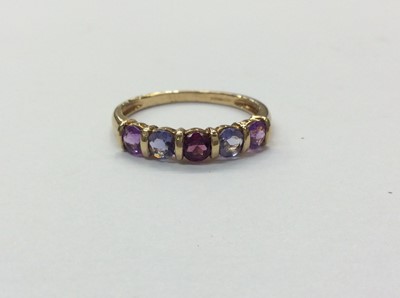 Lot 656 - 9ct gold multi gem set half eternity dress ring. Size U