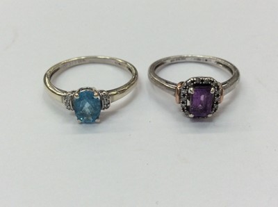 Lot 657 - Two 9ct white gold gem set rings with diamond borders. Sizes L & O