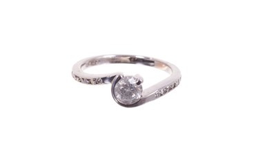 Lot 472 - Diamond ring with a brilliant cut diamond estimated to weigh approximately 0.50cts in 18ct white gold cross-over setting with diamond set shoulders